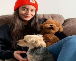 Marie is an animal lover and has adopted two cute dogs in her home.